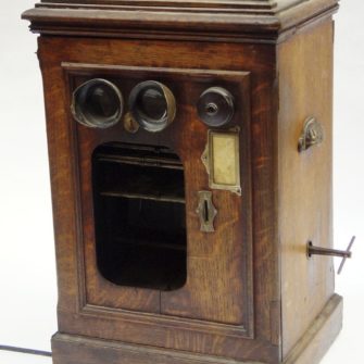 Coin-operated clockwork fairground stereo viewer